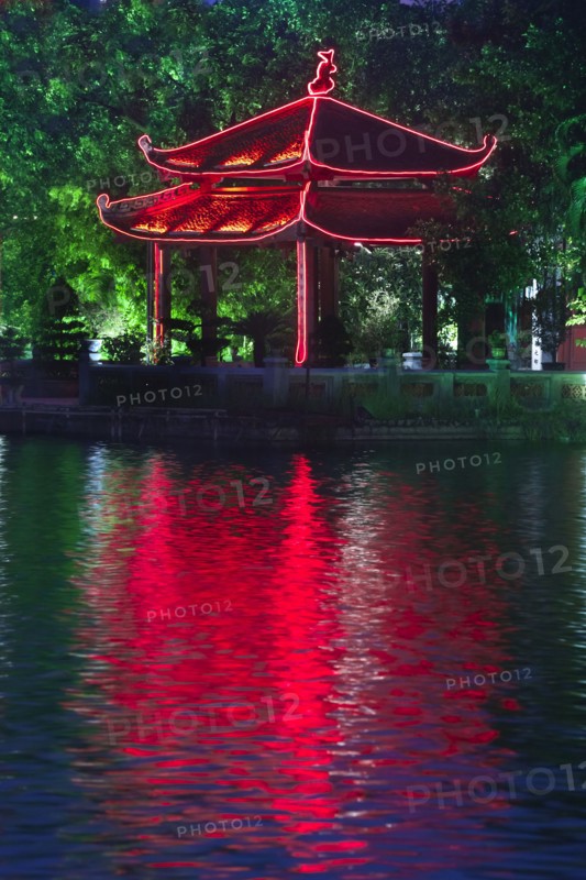 Colorful Vietnamese pagoda near water
