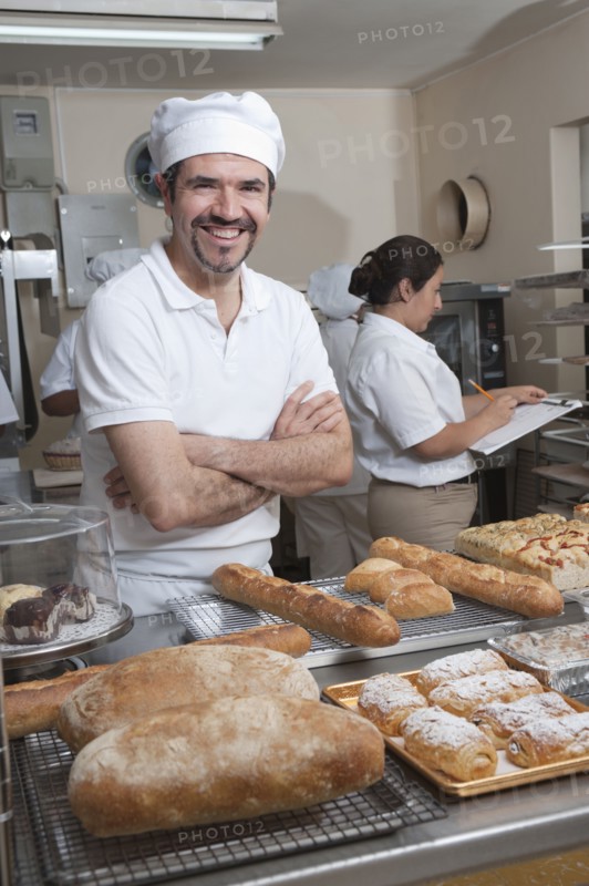 Hispanic baker working in commercial kitchen