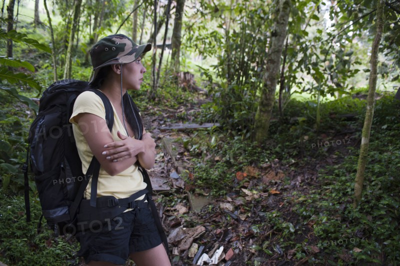 Hispanic woman hiking in forest