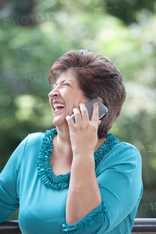 Hispanic woman talking on cell phone