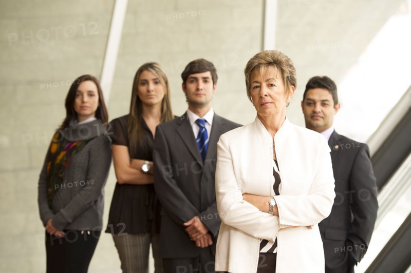 Hispanic business people standing together