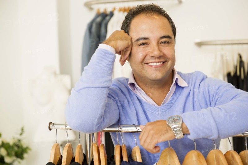 Hispanic man working in clothing store