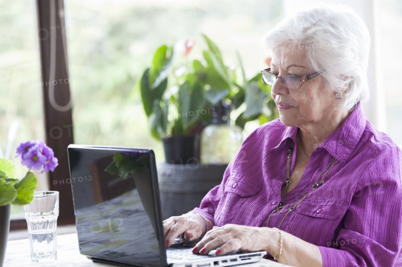 Hispanic woman using laptop