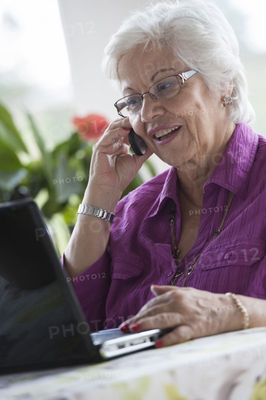 Hispanic woman using laptop