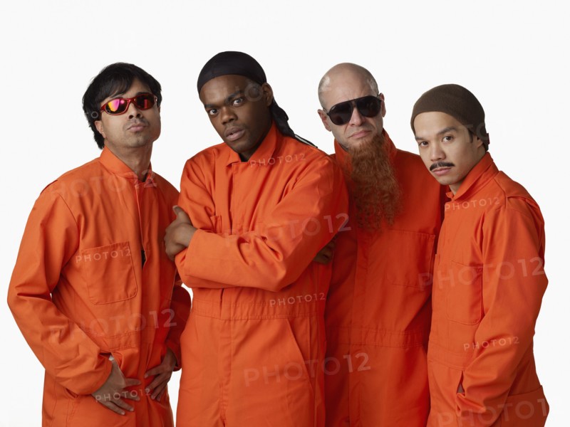 Multi-ethnic criminals in prison uniforms