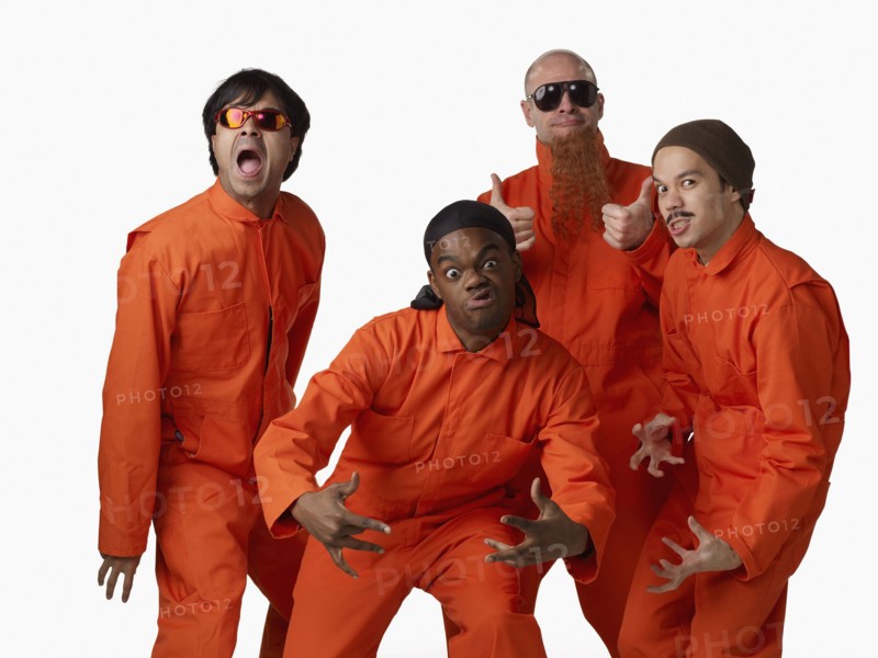 Multi-ethnic criminals in prison uniforms