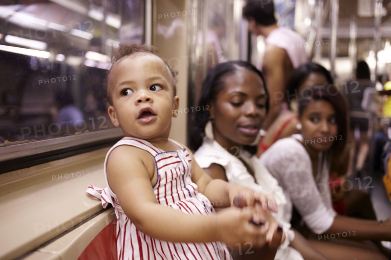 Family watching curious mixed race girl