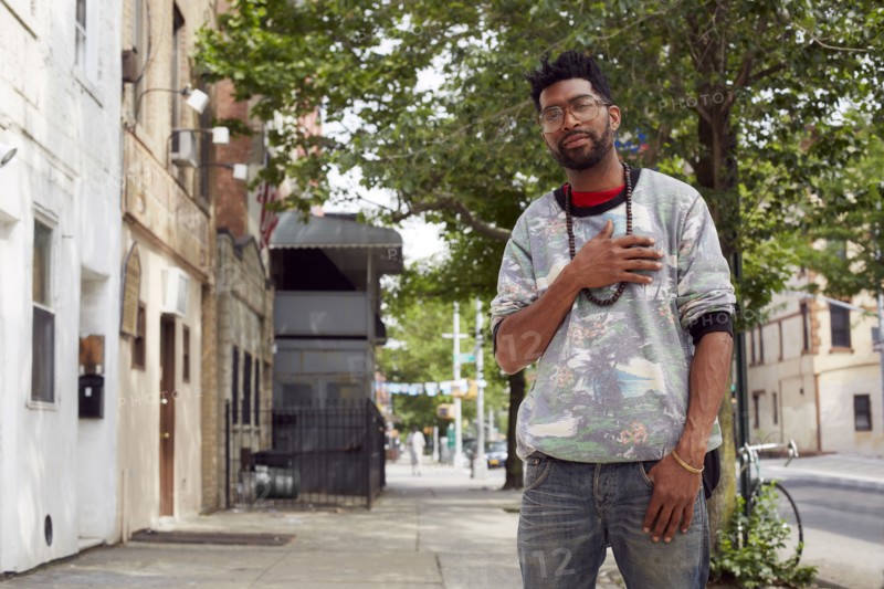 Black man standing on city street