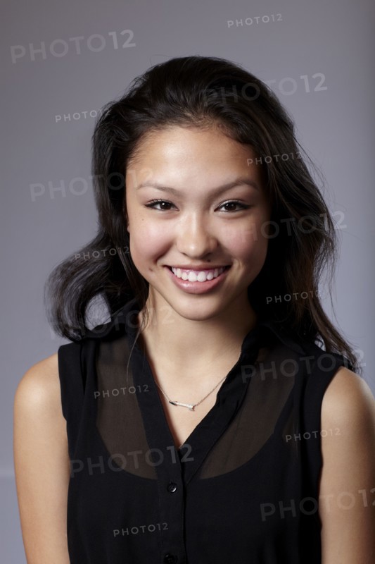 Mixed race teenage girl smiling