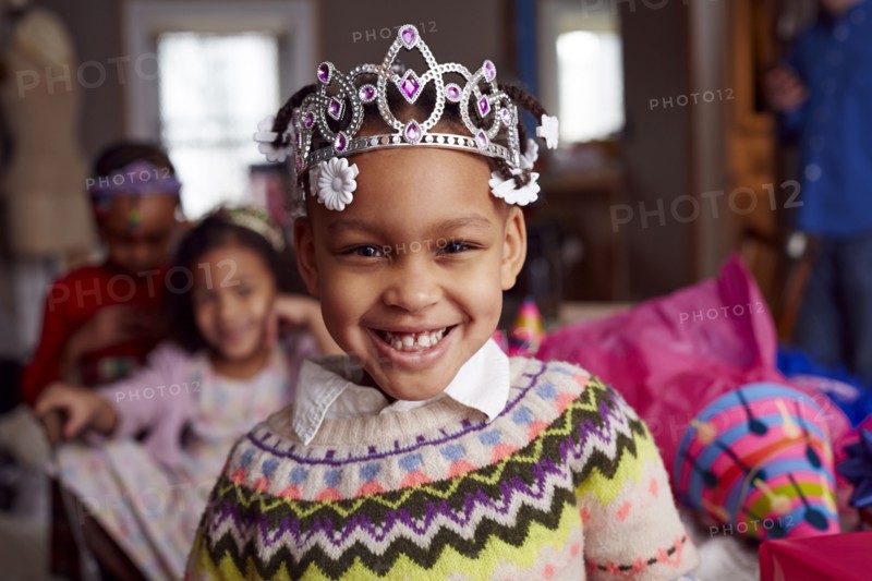 Smiling girl wearing tiara at party