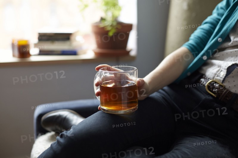 Close up of woman holding mug of tea