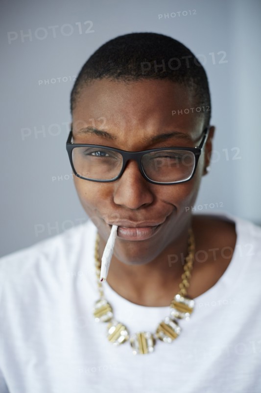 Close up of mixed race woman smoking cigarette