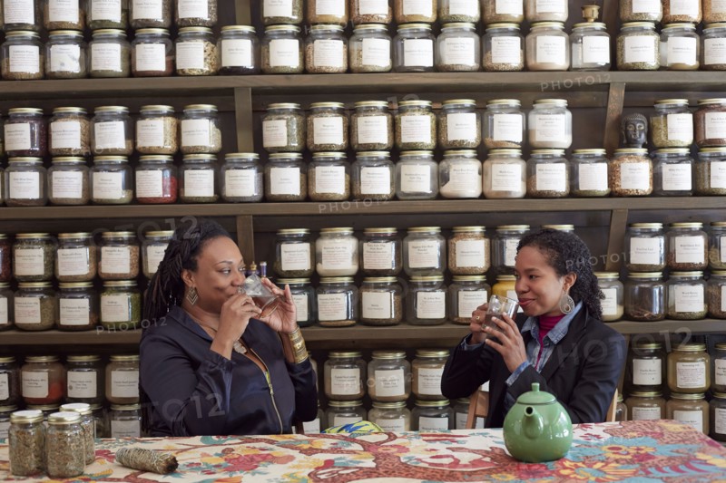 Black women drinking tea in tea shop