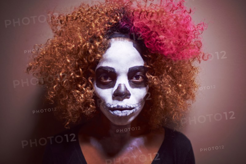 Black woman wearing skull makeup