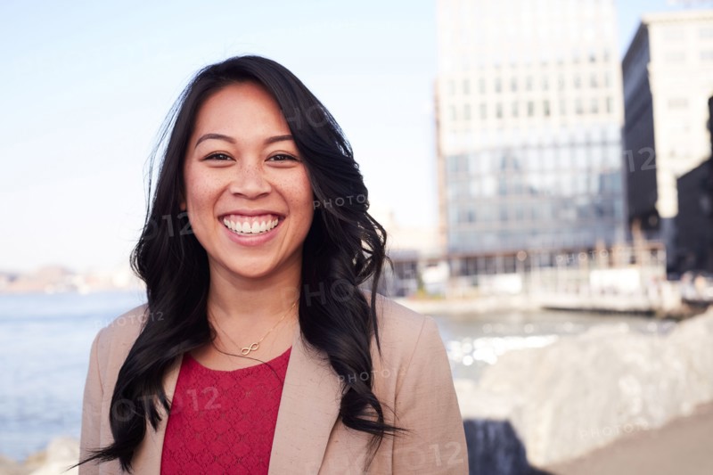 Pacific Islander woman smiling at waterfront