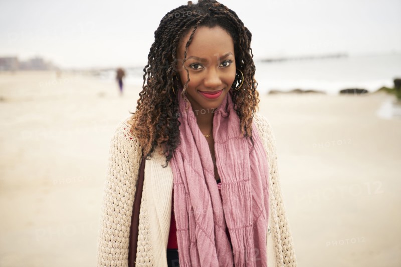 Black woman smiling on beach
