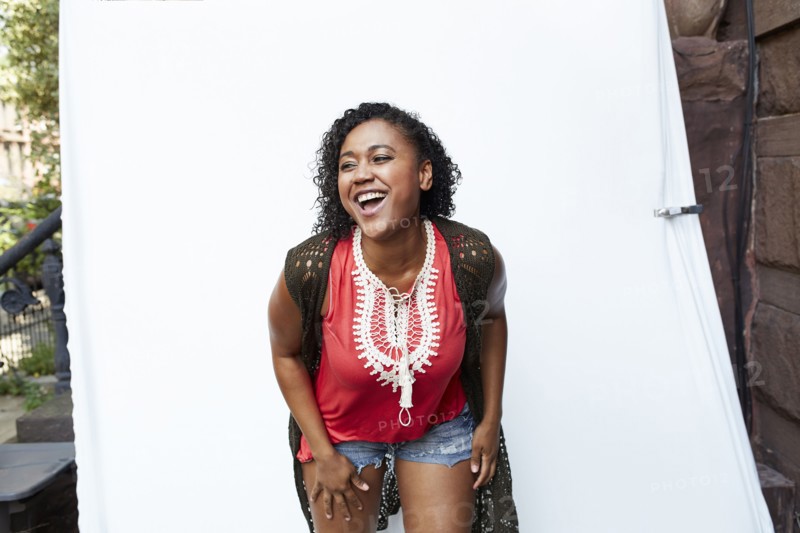 Mixed Race woman laughing