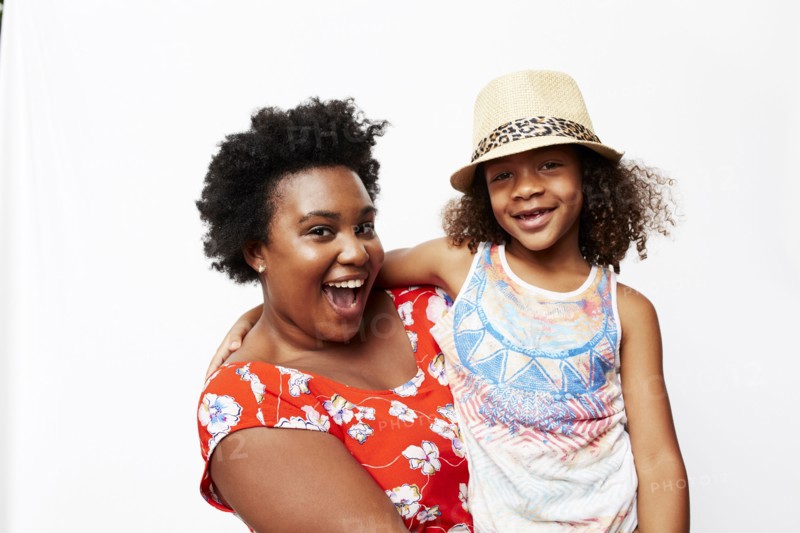 Portrait of smiling mother holding daughter