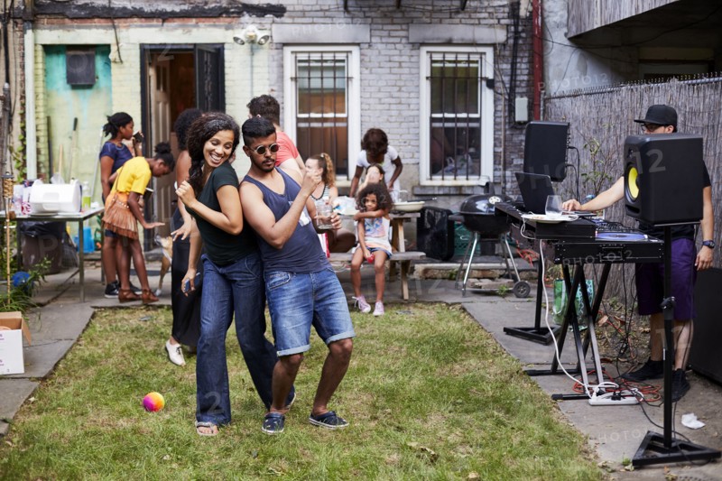Couple dancing at backyard party