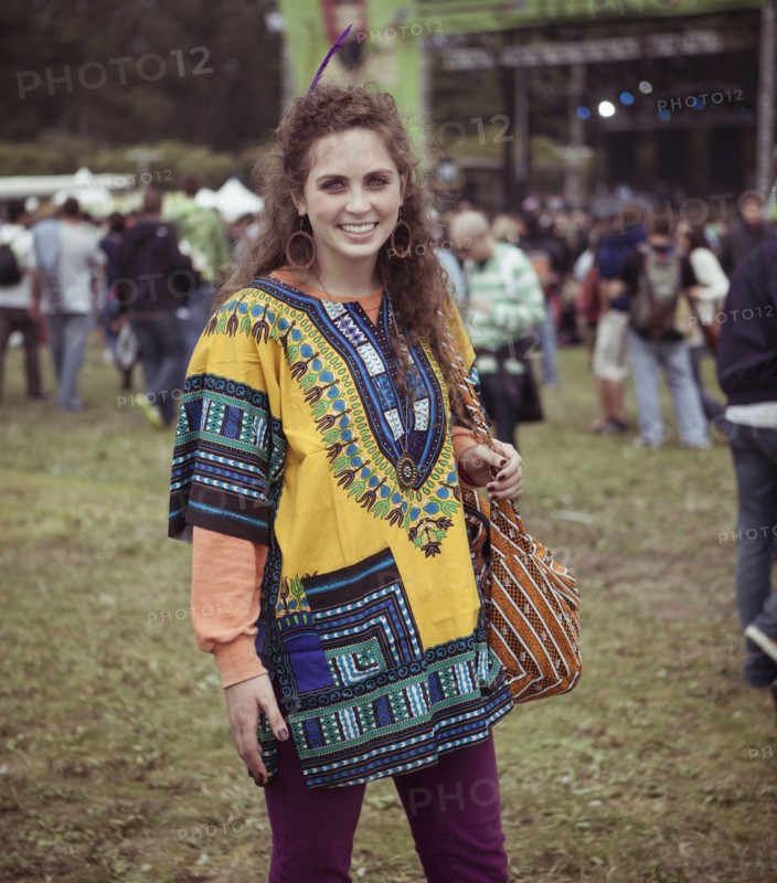 Woman wearing decorative poncho at festival