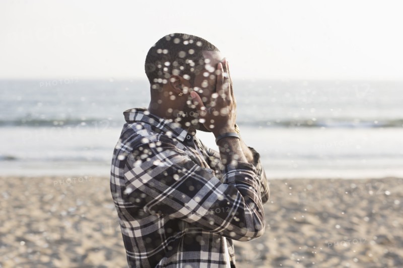 African American man playing on beach