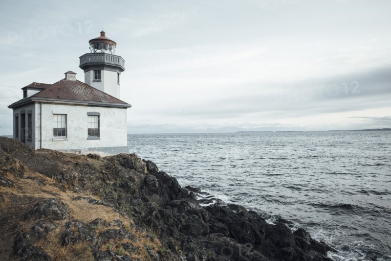 Lighthouse on rocky beach