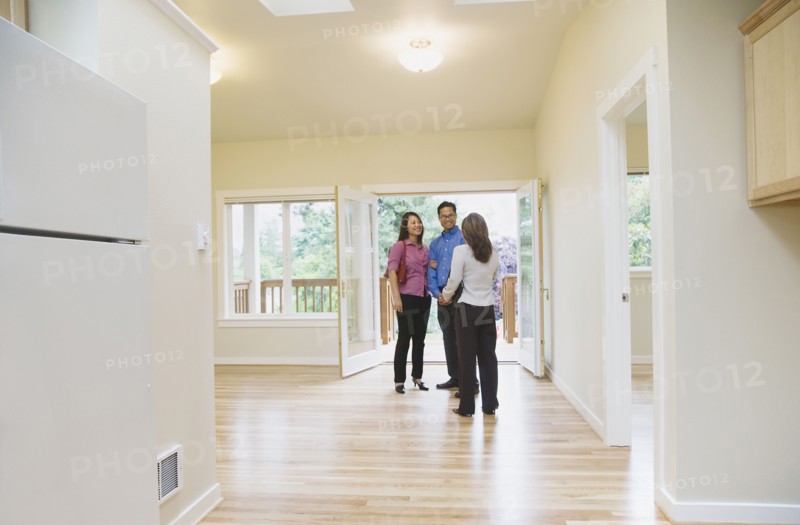 Asian couple looking at new house