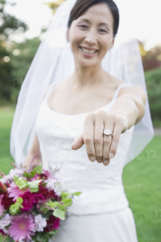Asian bride showing wedding ring