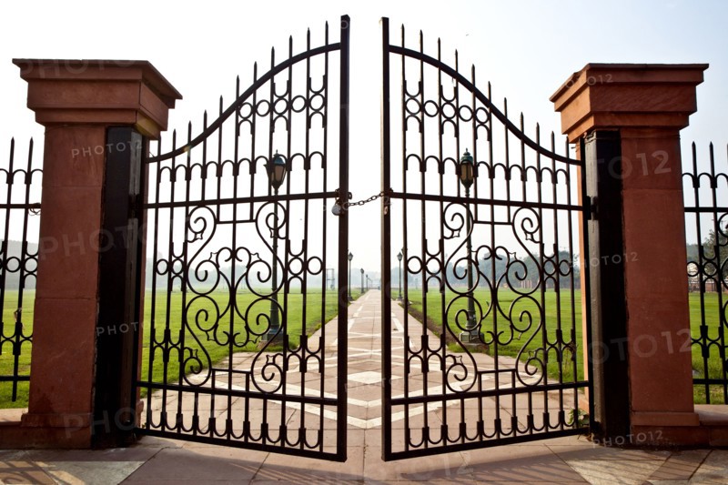 Large iron gates secured with padlock