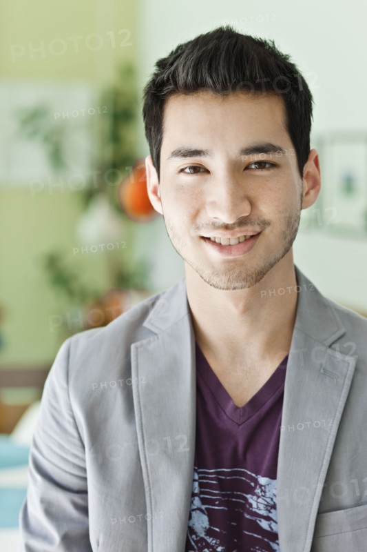 Smiling mixed race man in jacket