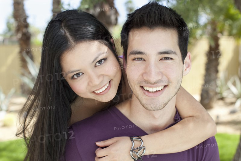 Smiling woman hugging husband