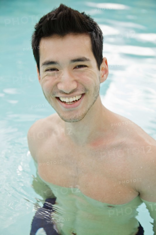 Mixed race man in swimming pool