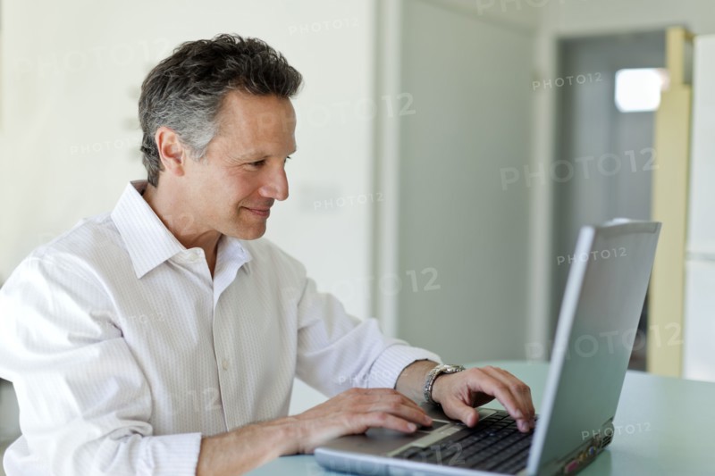 Man typing on laptop