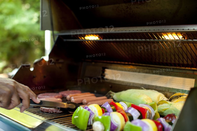African American man grilling food on barbecue