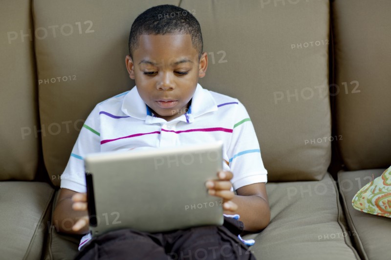 African American boy using digital tablet