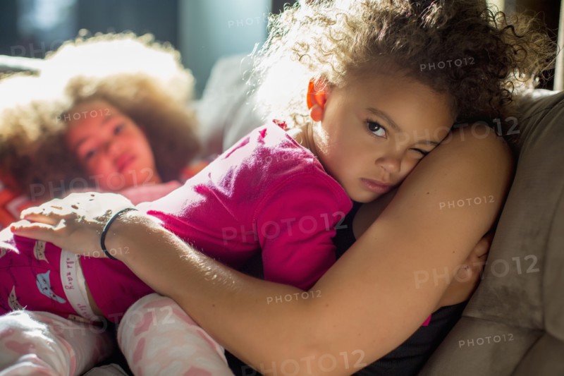 Mother holding daughter