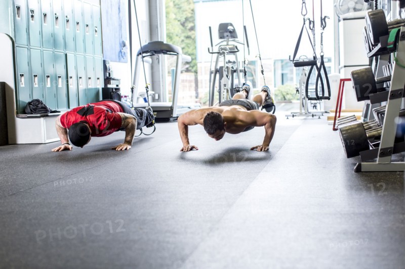 Pacific Islander man working out in gym