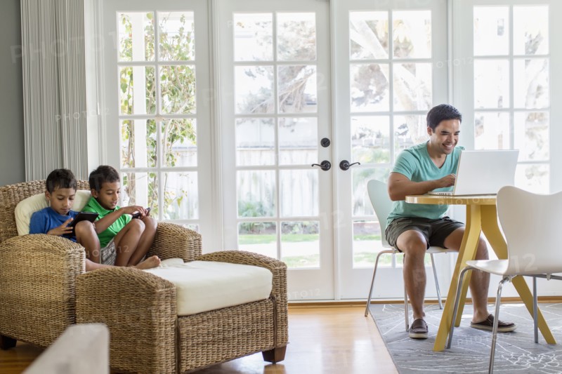 Hispanic family relaxing in living room