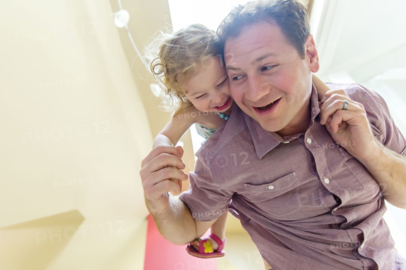 Father carrying daughter piggyback