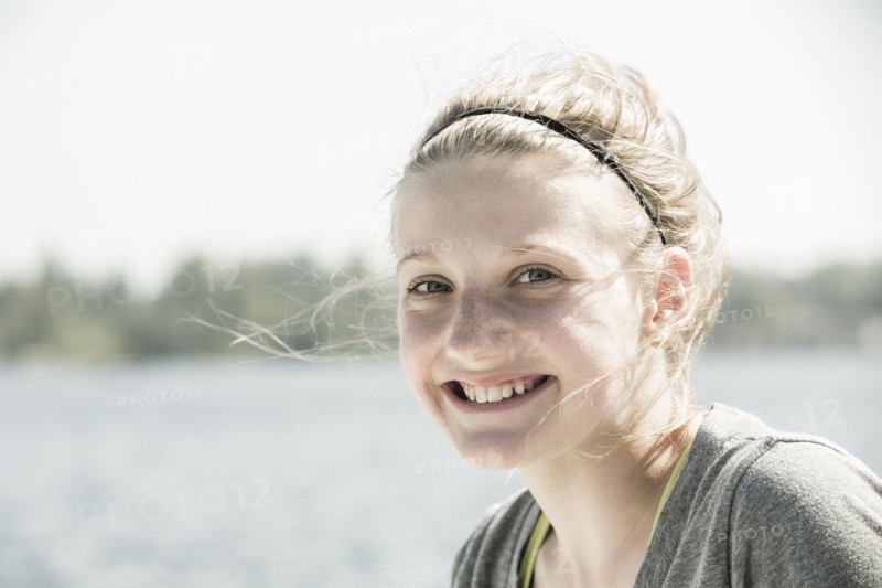Caucasian girl smiling outdoors