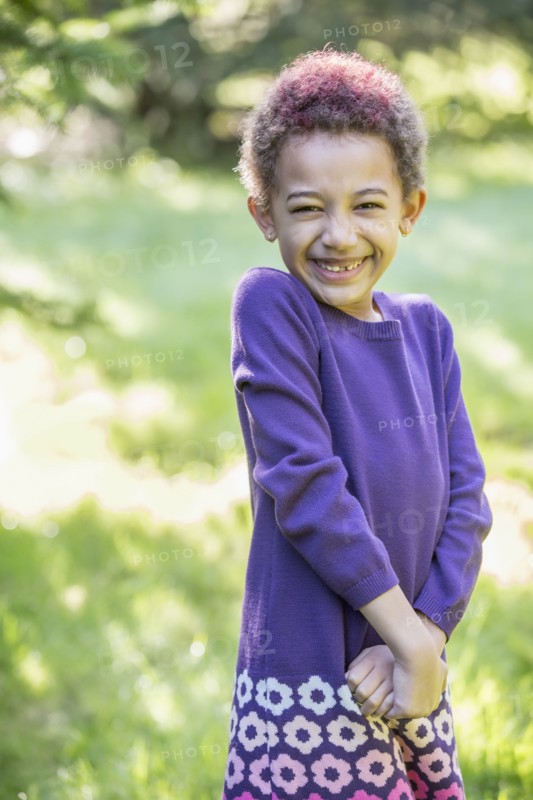 Mixed race girl smiling outdoors
