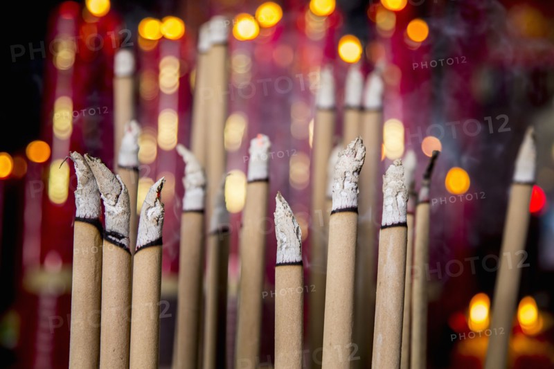 Burning incense in Buddhist temple
