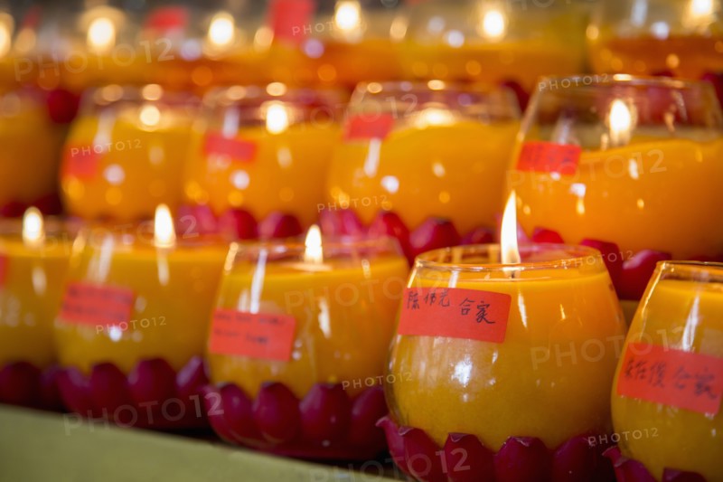 Burning candles for New Year in Buddhist temple