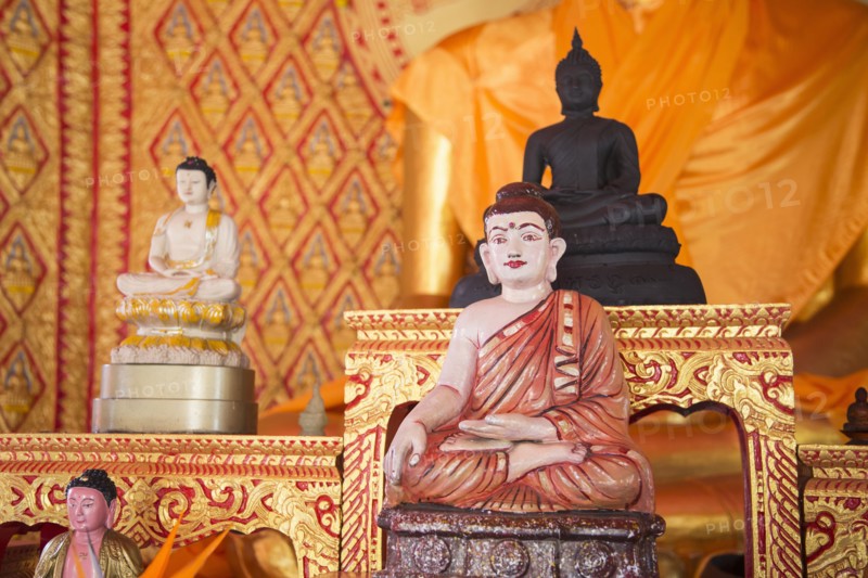 Ornate Buddha statues in temple