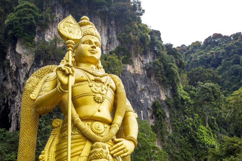 Gold statue of Murugan outside Batu Caves