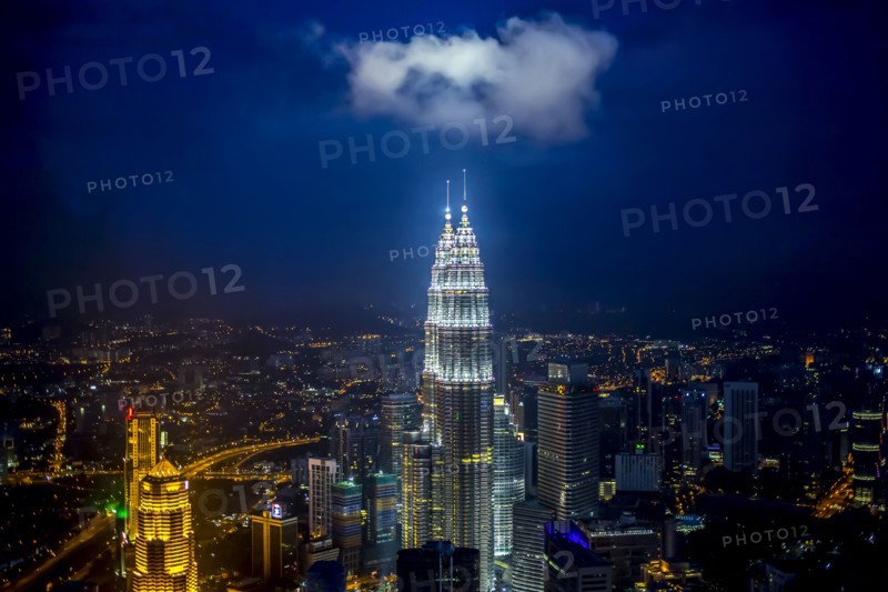 View of city skyline lit up at night