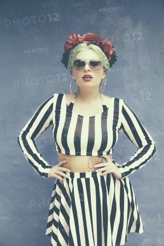 Caucasian woman wearing striped outfit