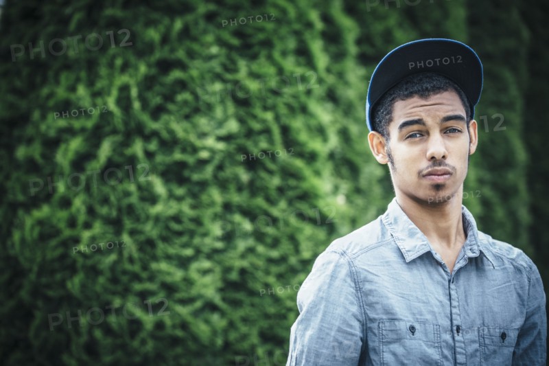 Mixed race boy standing outdoors