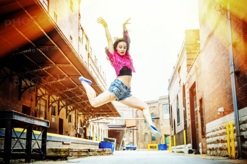 Caucasian woman dancing in street