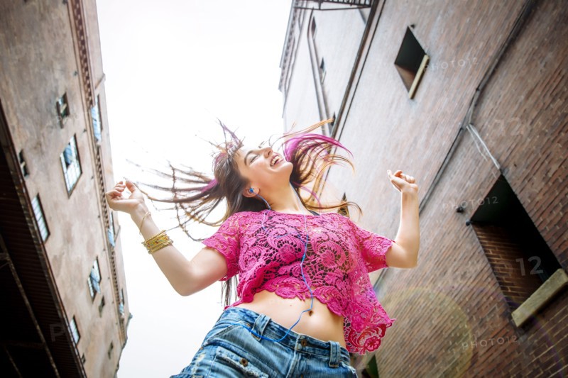 Low angle view of Caucasian woman dancing outdoors